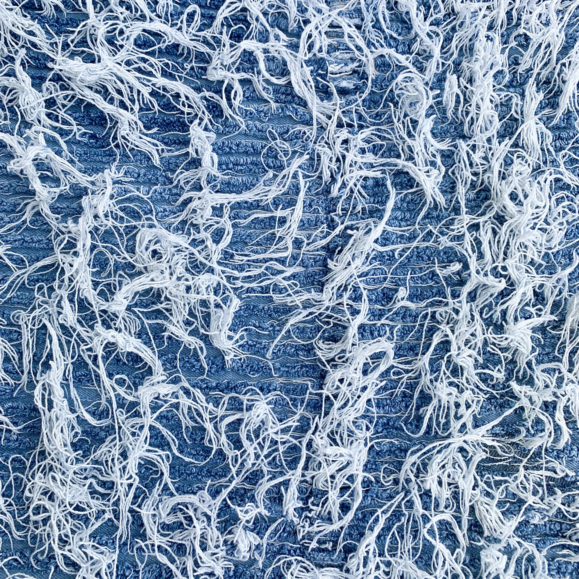 All-over frayed denim fabric